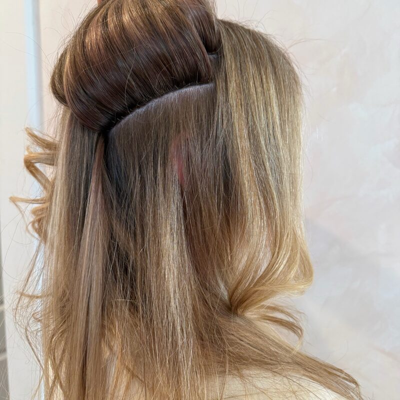 Invisible Bead Extensions® installation — a discreet beaded track with natural hair blended over it