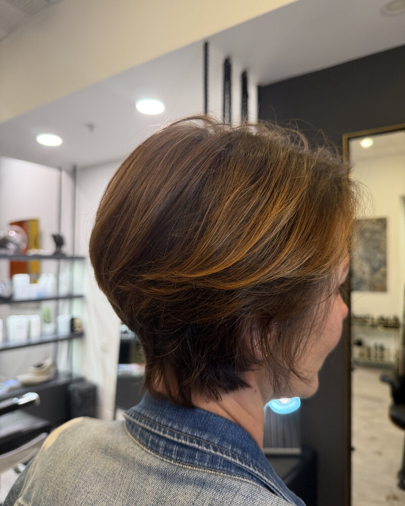 Smooth, glossy straightened hair after a keratin smoothing treatment